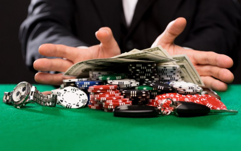 tokens and bills on the casino table