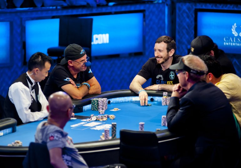 Experienced players at poker table