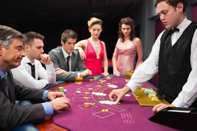 Blackjack game a man doubts whether to take another card or not
