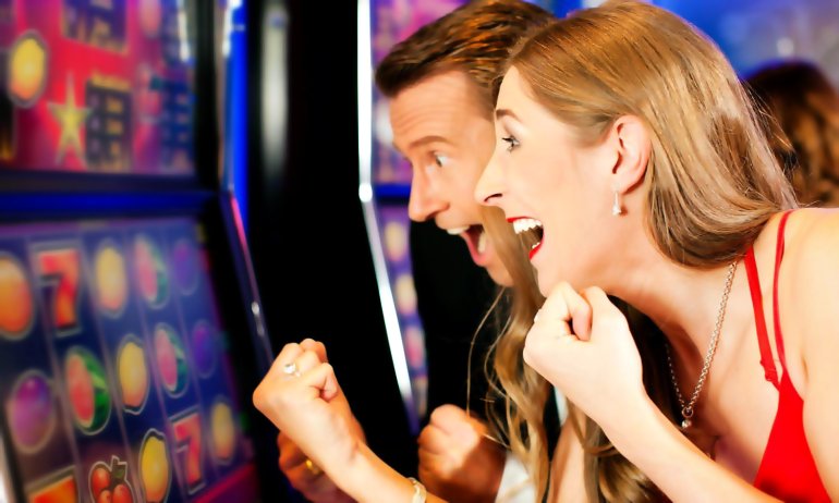 A lucky couple excited about slots