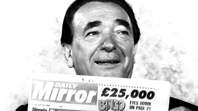 Media mogul Robert Maxwell with a newspaper in his hands